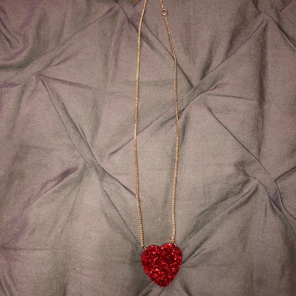 Gold necklace with red heart